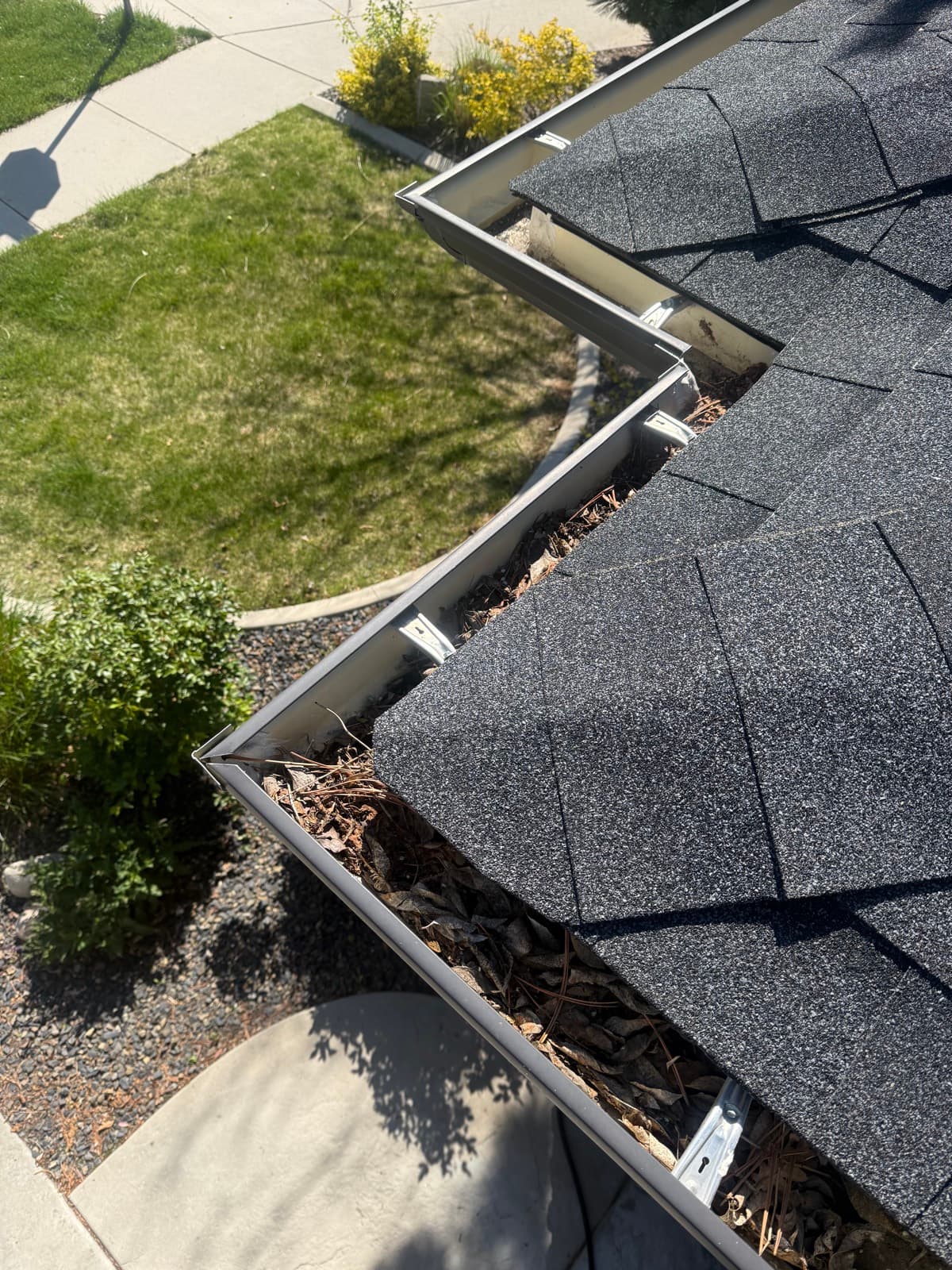 Debris removed by hand, gutters left clean